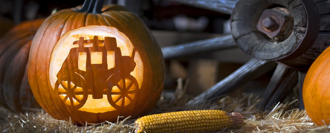 Light the night with a pumpkin carving template of a stagecoach